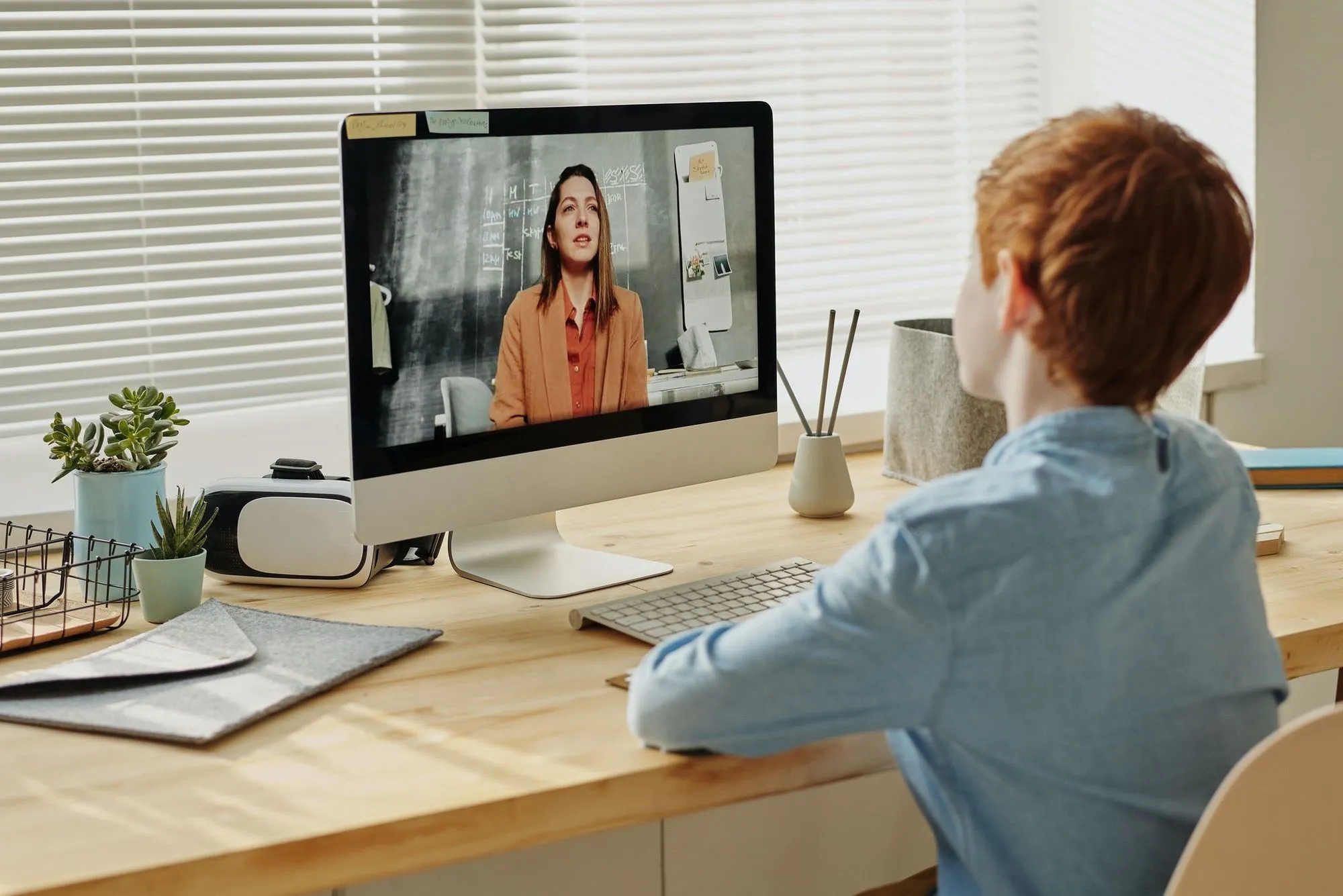 child watching virtual lesson on desktop computer