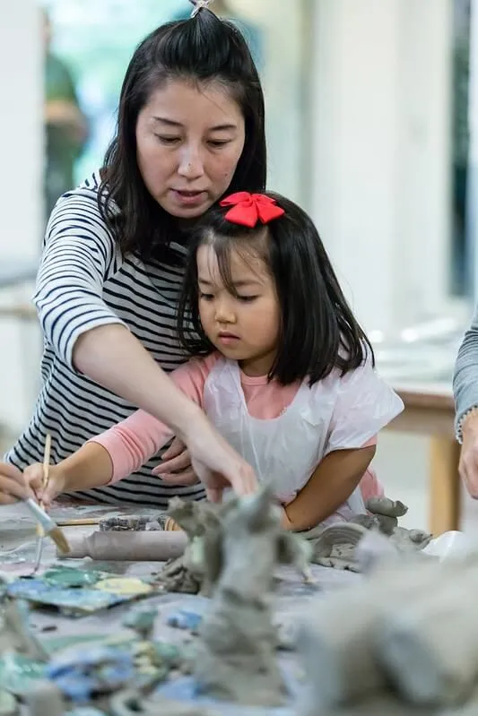 Mum and daughter making history craft learning activities