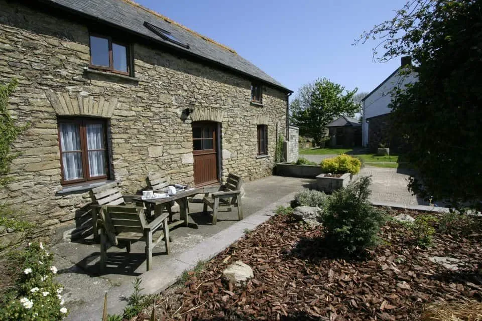 Outdoor seating area of Polean Farm Cottages, Cornwall.