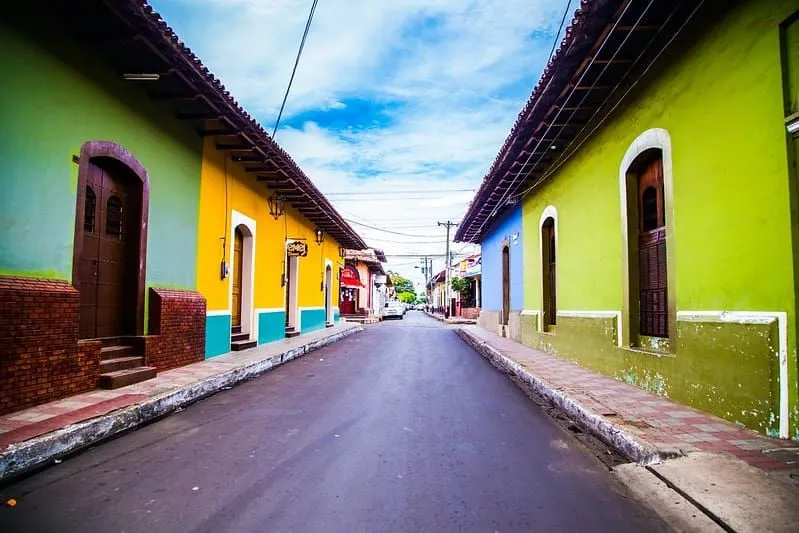 Street lined with colourful houses in Leon, Nicaragua.