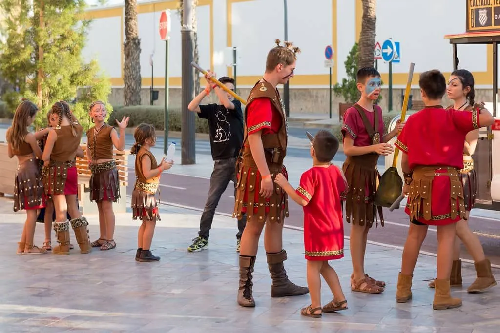 Children dressed in Roman soldier costumes.