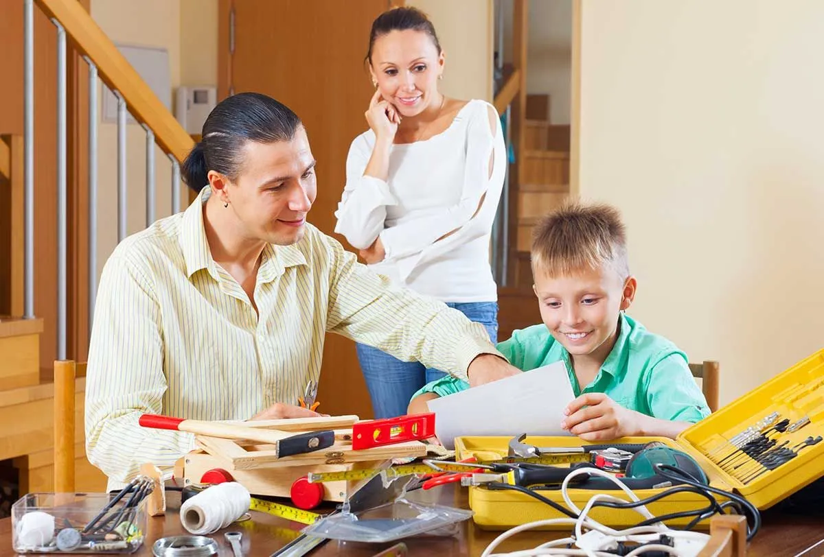 Family looking at how to make a model Viking longboat.