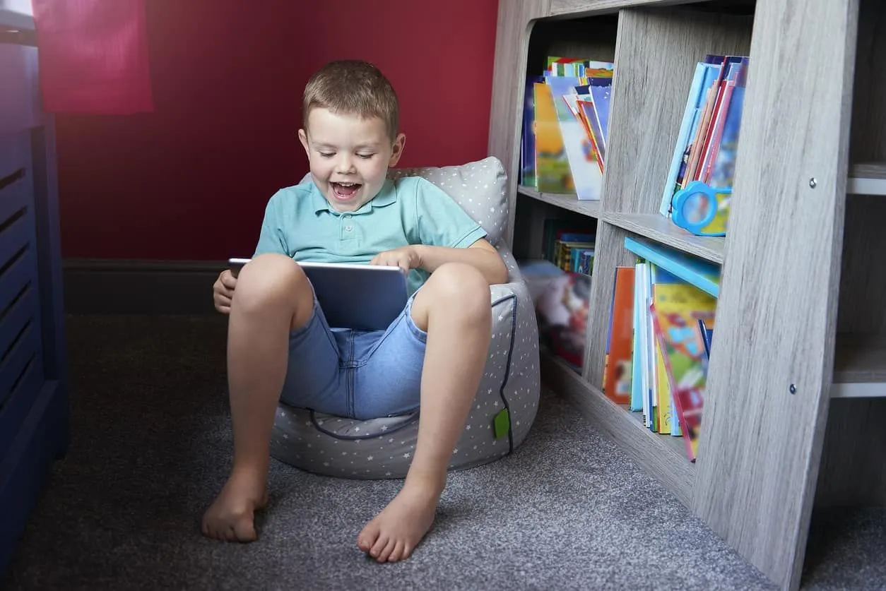 Boy reading a book from a bookcase perfect for any space