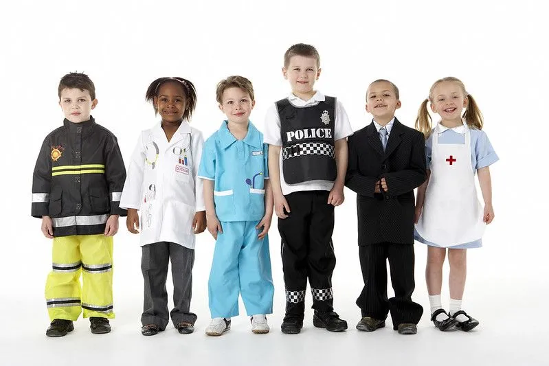 Kids dressing up in work costumes, in police outfit. 