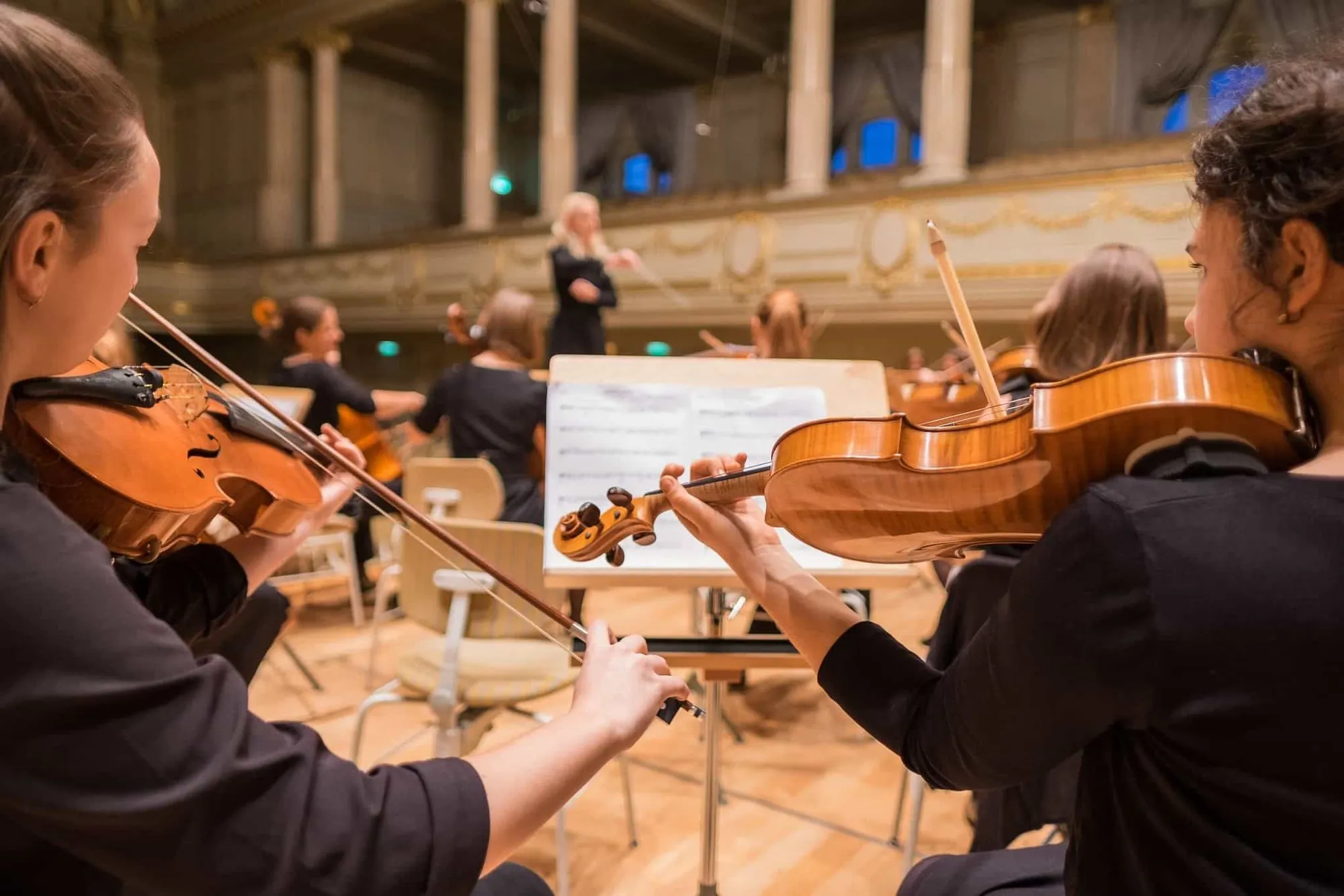 Playing together in an orchestra.